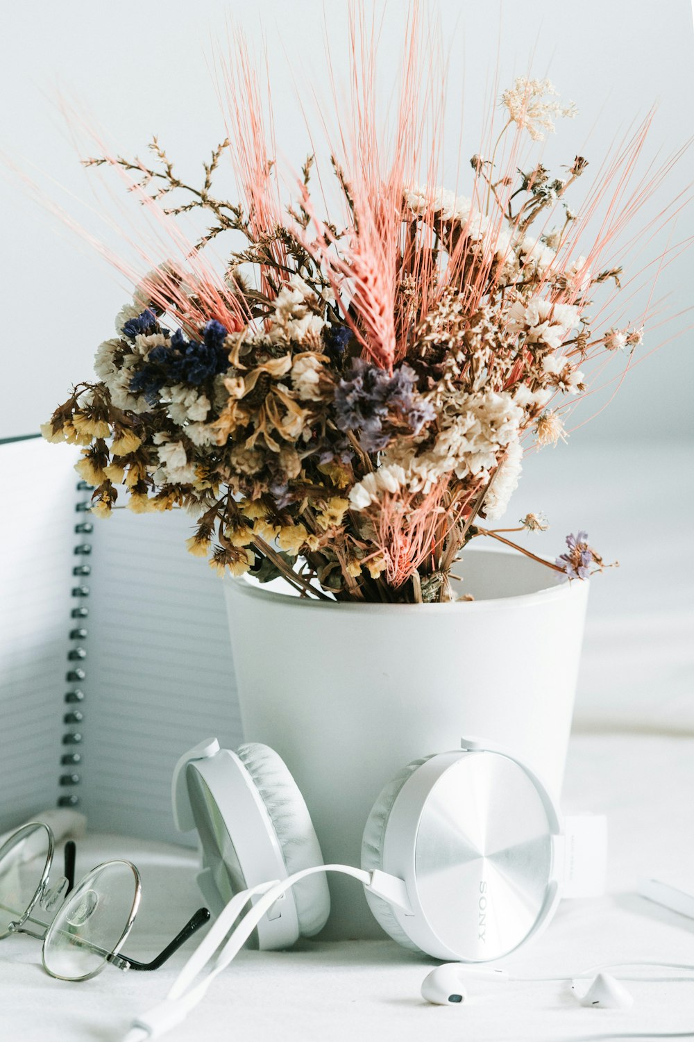 white and pink flowers in white ceramic vase