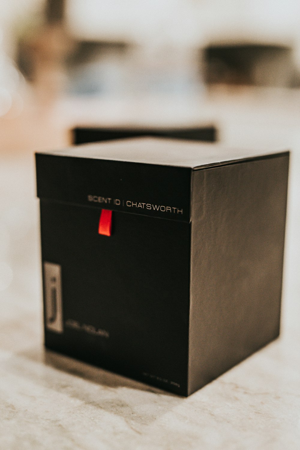 black and red box on white table