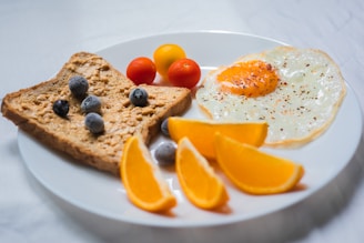 sliced orange fruit on white ceramic plate