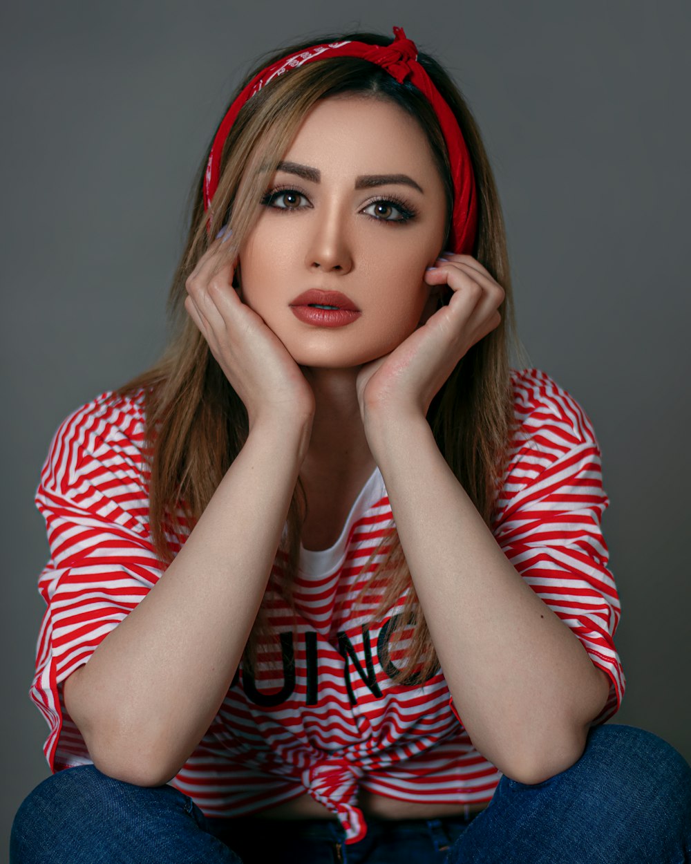 woman in red and white striped long sleeve shirt