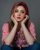 woman in red and white striped long sleeve shirt