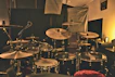 A sleek recording studio bathed in soft ambient light, showcasing minimalist acoustic panels and modern equipment.
