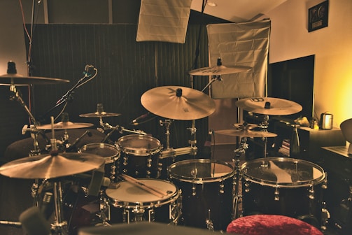 A cozy recording studio with professional lighting and streaming equipment.