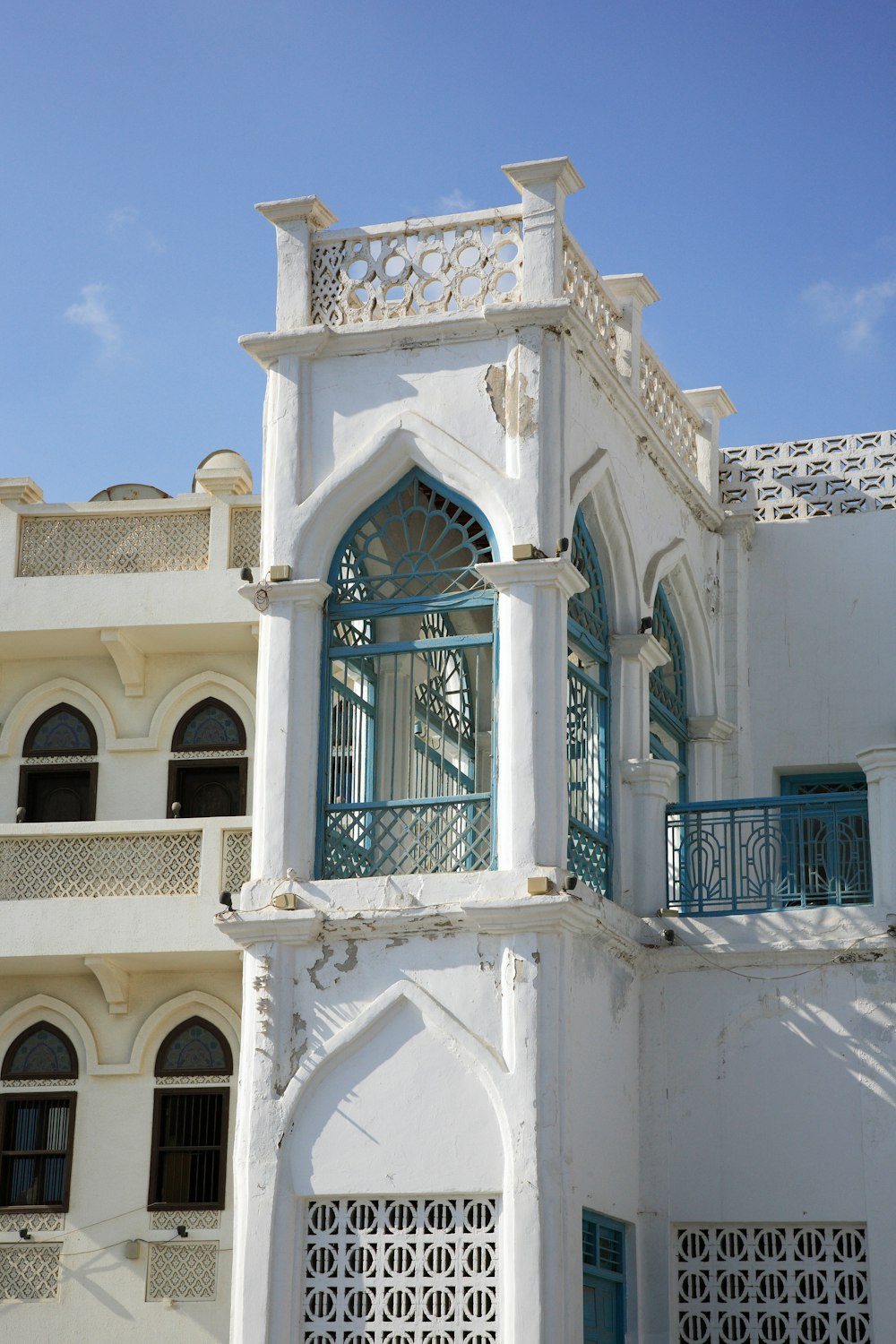 white concrete building under blue sky during daytime