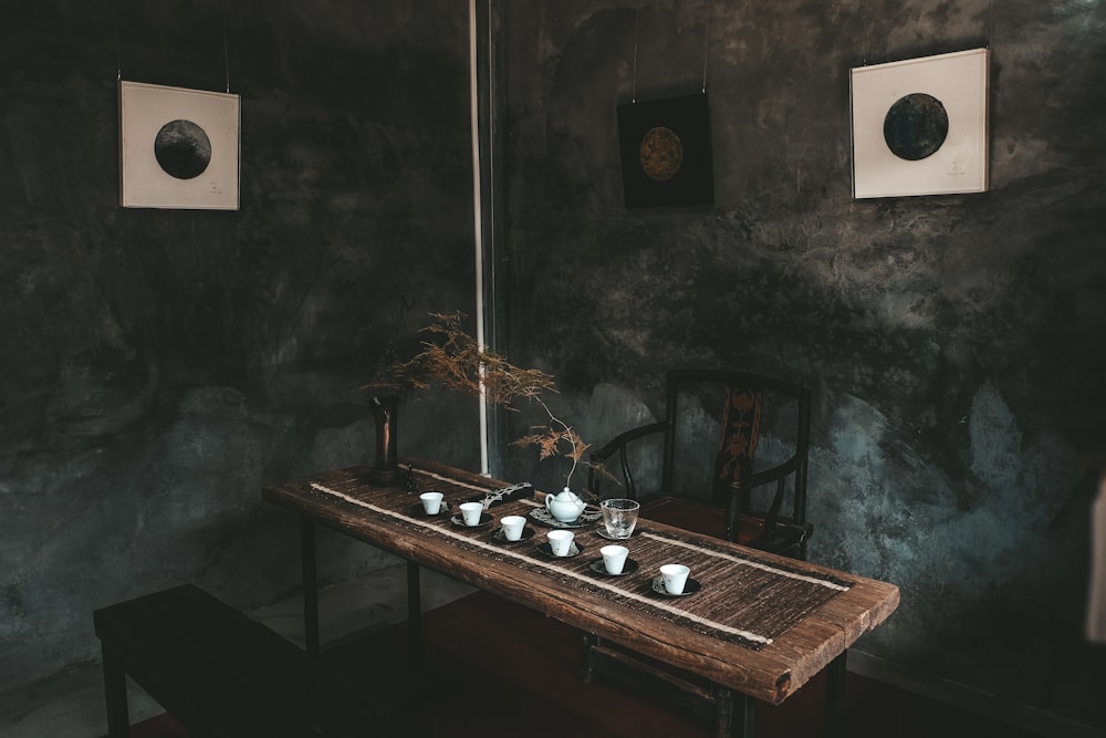 brown wooden table with bottles and mugs