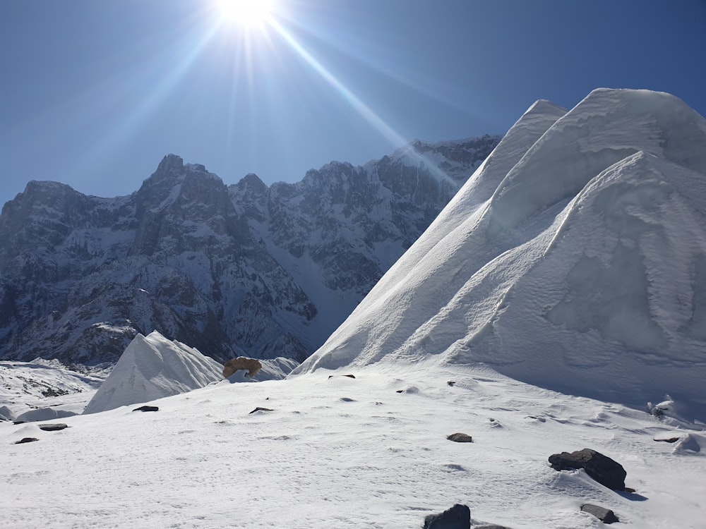 snow covered mountain under blue sky during daytime