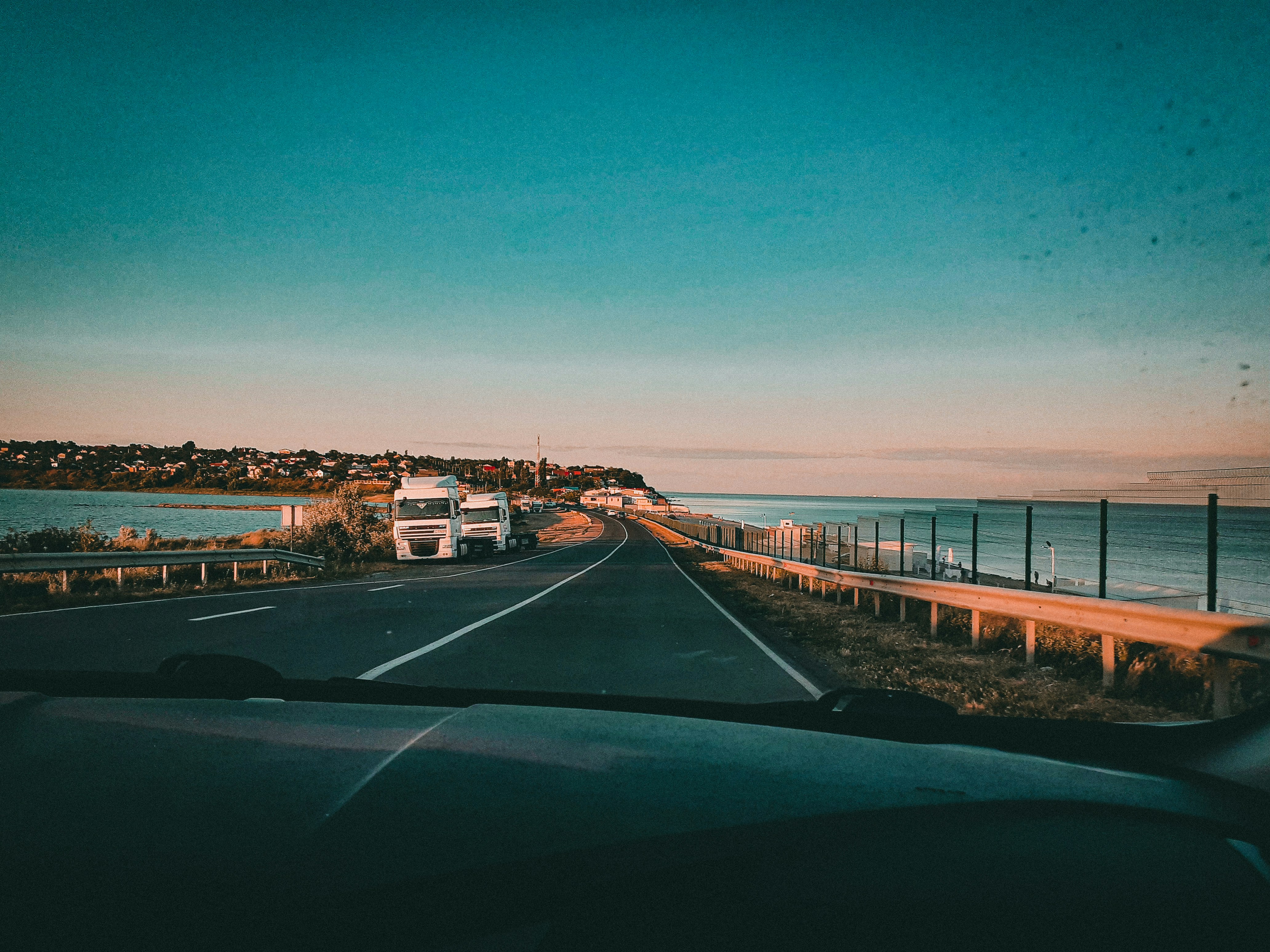 black and white concrete bridge under blue sky during daytime