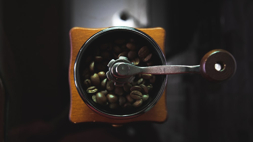 a coffee grinder filled with coffee beans