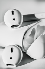 A sleek display of lhuoed earbuds and powerbank showcasing modern design.