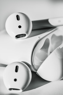 Close-up of wireless earbuds resting on a sleek charging case.