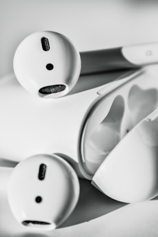 Close-up of modern wireless earbuds with a minimalist design.