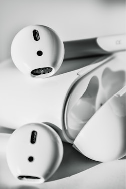 A sleek pair of wireless earbuds showcasing minimalist design.