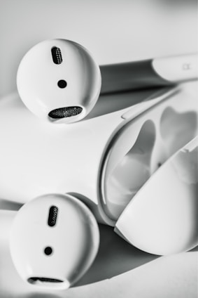 A sleek display of lhuoed earbuds and powerbank showcasing modern design.