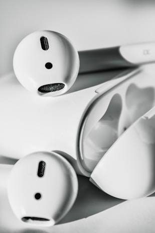 A sleek pair of modern wireless earbuds showcasing their minimalist design.