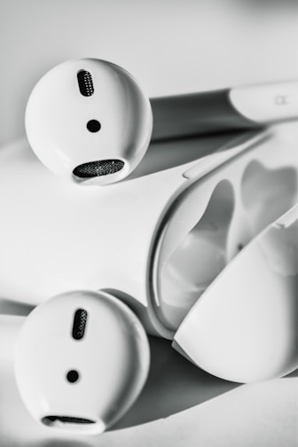 A sleek pair of modern wireless earbuds showcasing their minimalist design.