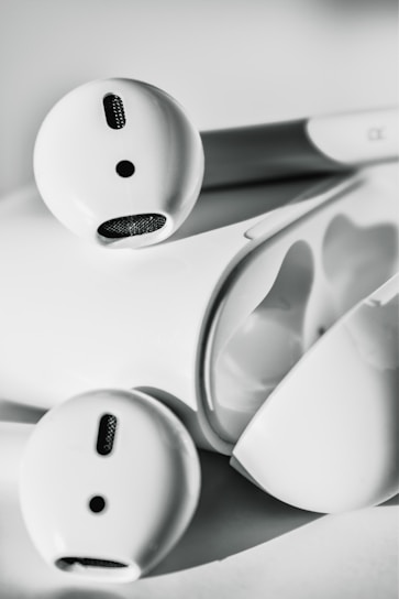 A sleek pair of wireless earbuds showcasing minimalist design.