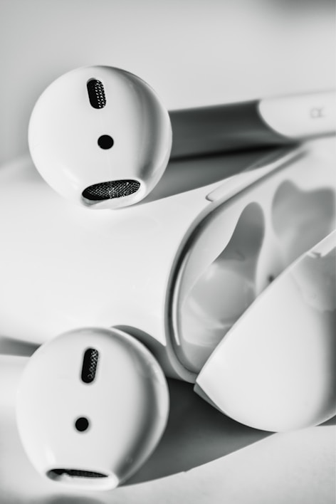 Close-up of wireless earbuds resting on a sleek charging case.