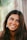 woman with black hair smiling