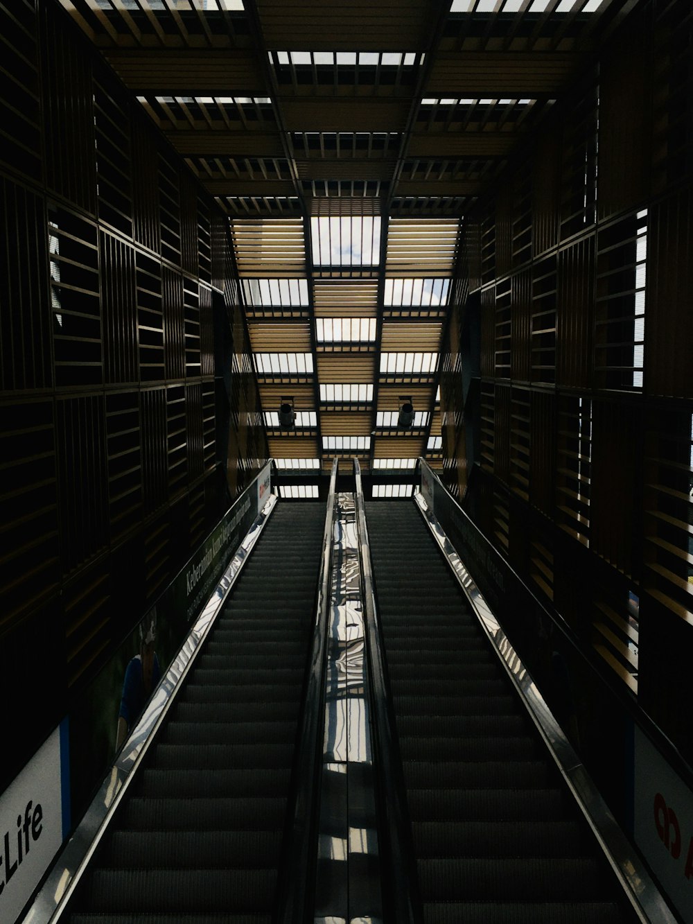 black and white escalator in a building