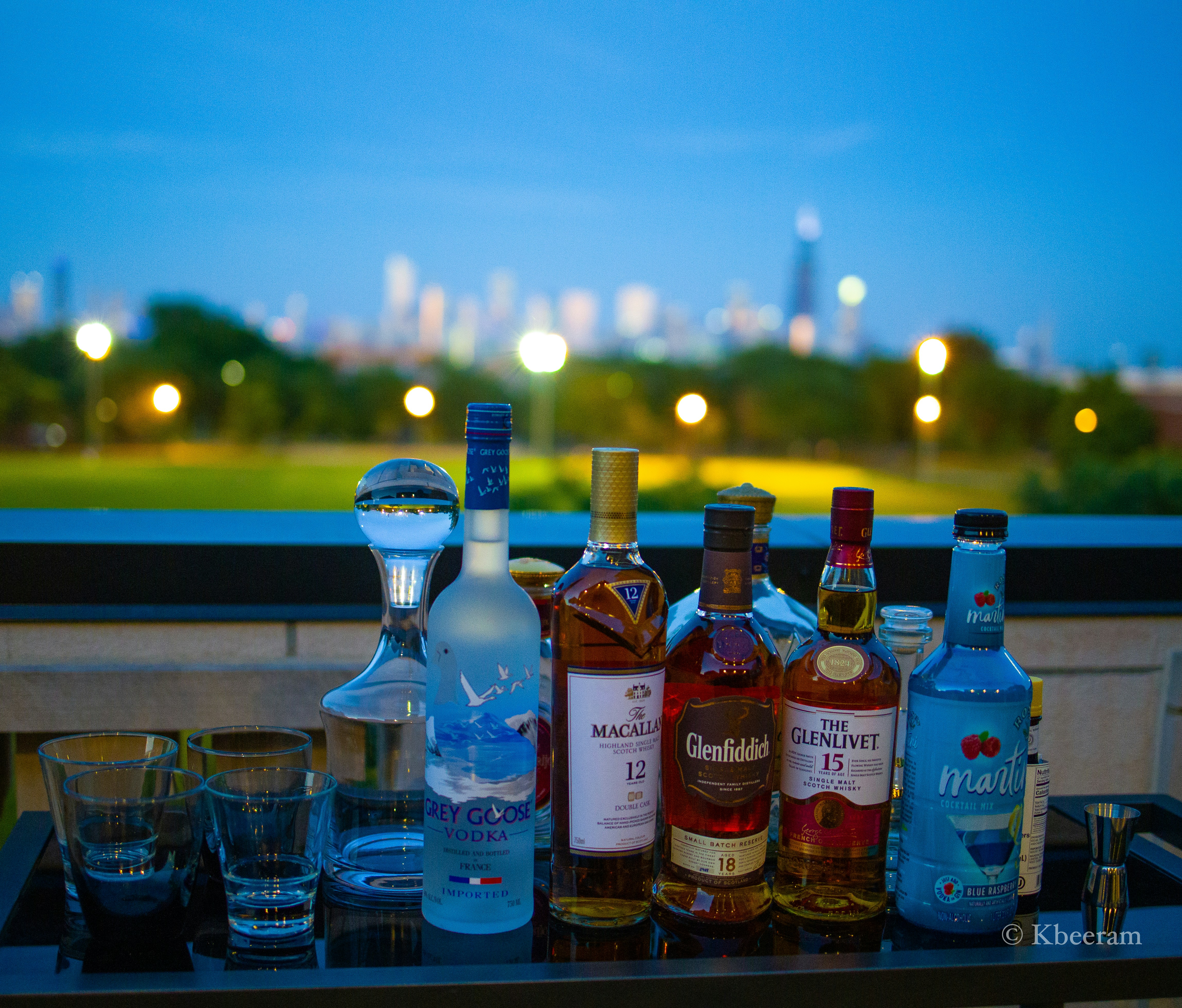 assorted glass bottles on brown wooden table