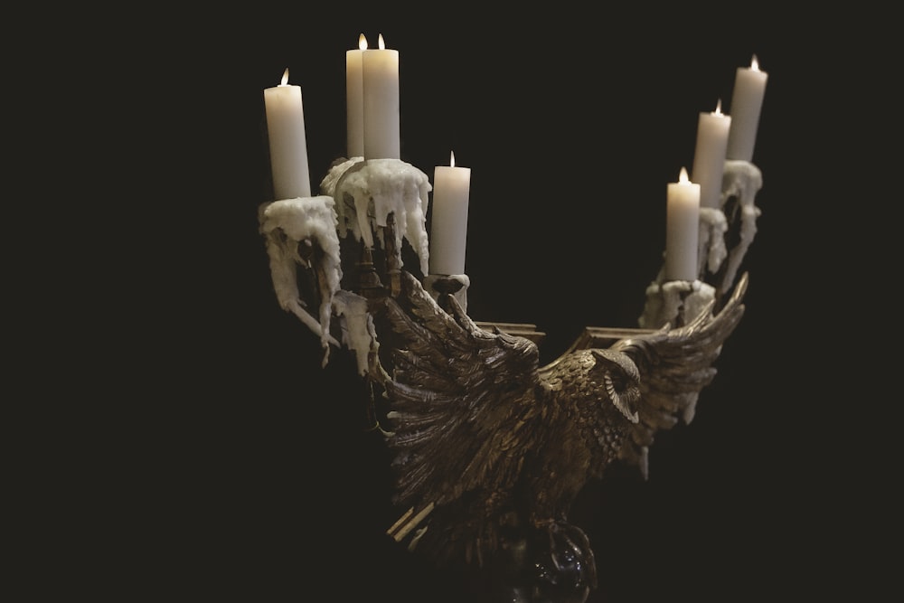 white candles on brown wooden tree trunk