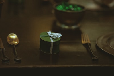 silver fork beside green and white box leavesden google meet background