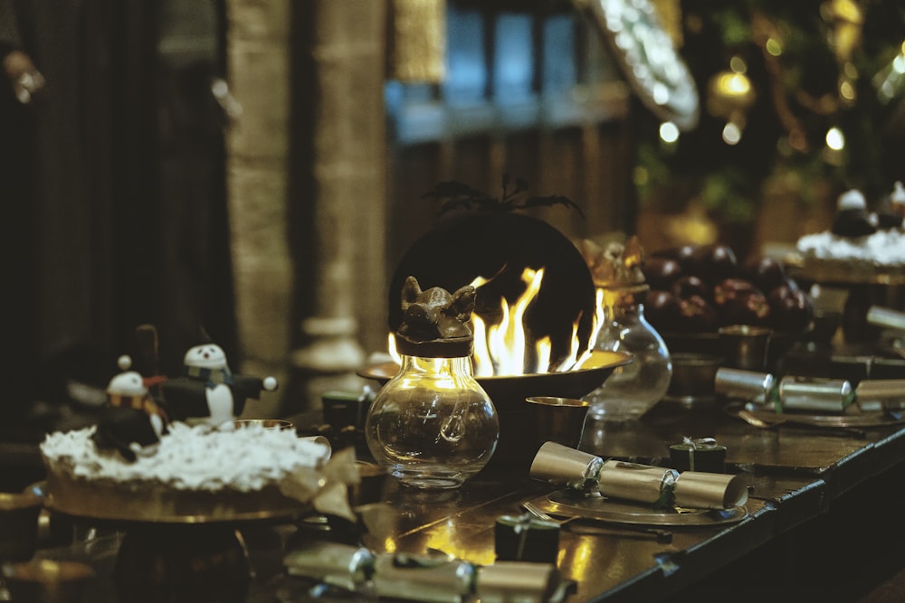 lighted candles on clear glass candle holder