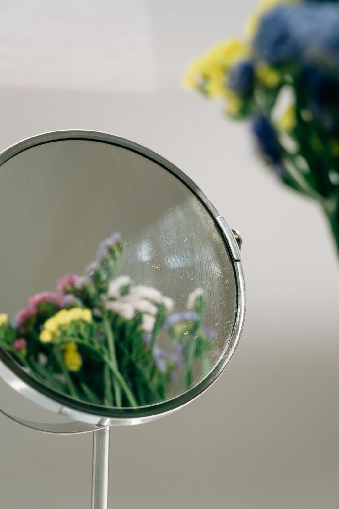 purple flowers on stainless steel round mirror