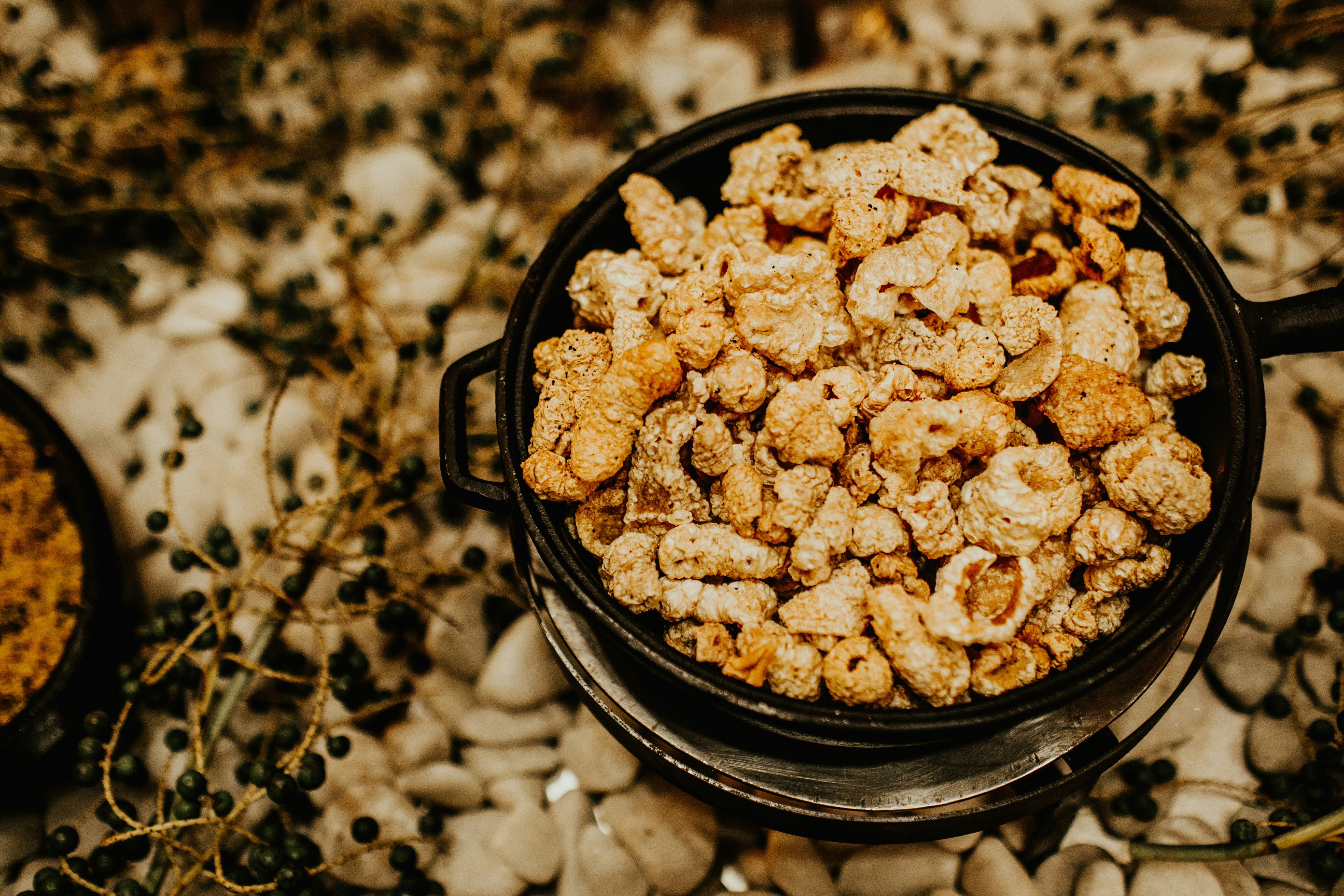 brown and white round food in black round bowl