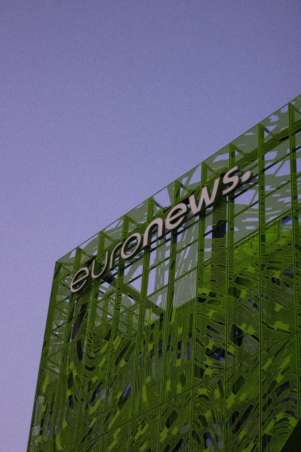 green and black building under blue sky during daytime
