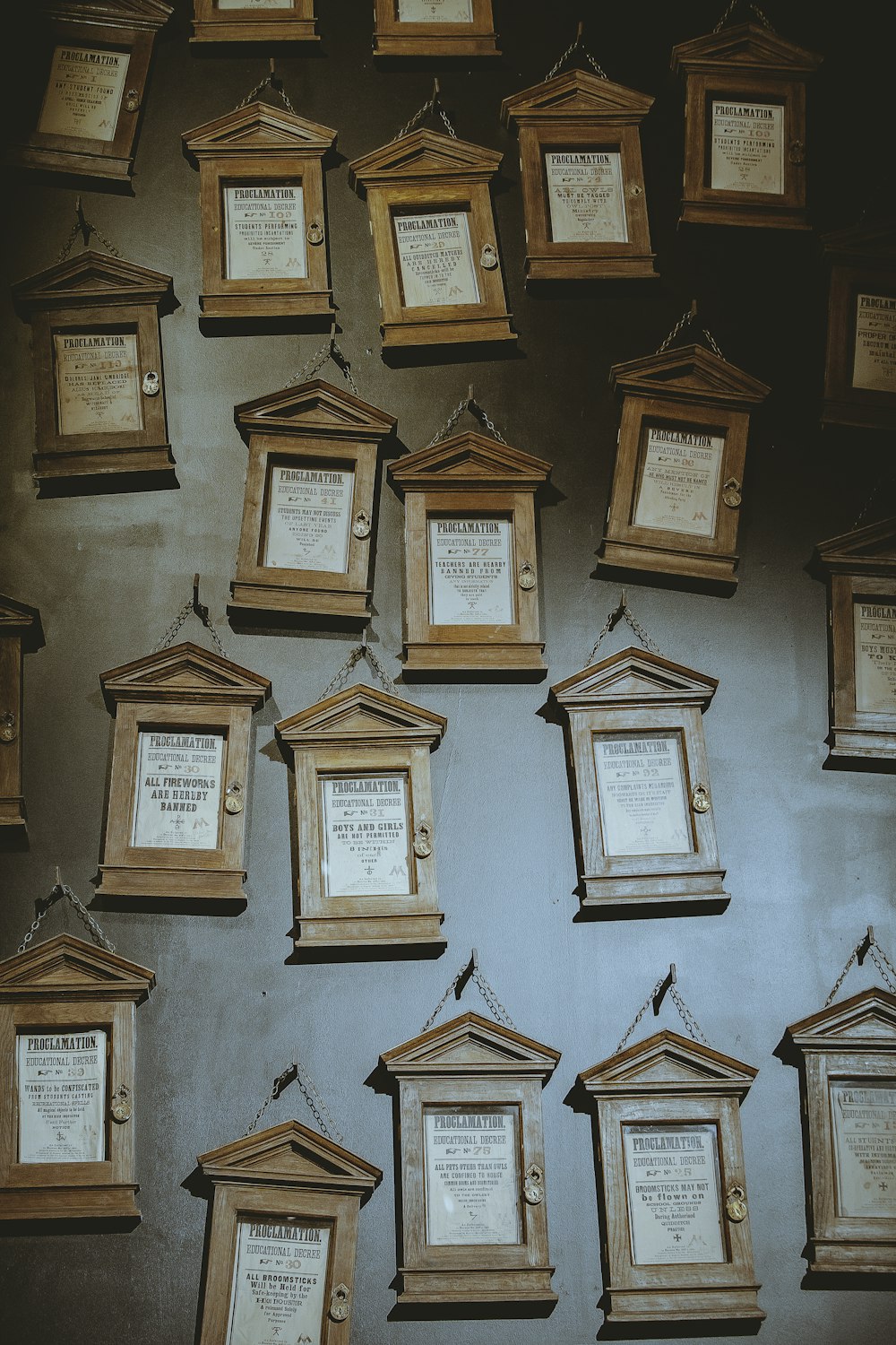 brown wooden photo frames on brown wooden wall