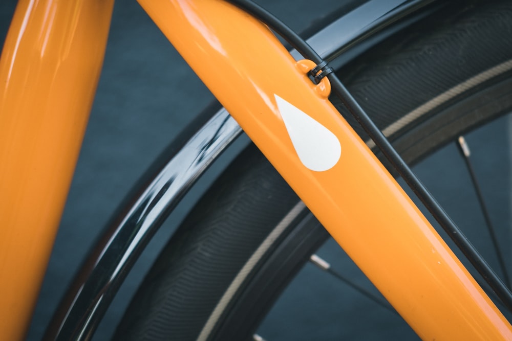 orange and black bicycle wheel