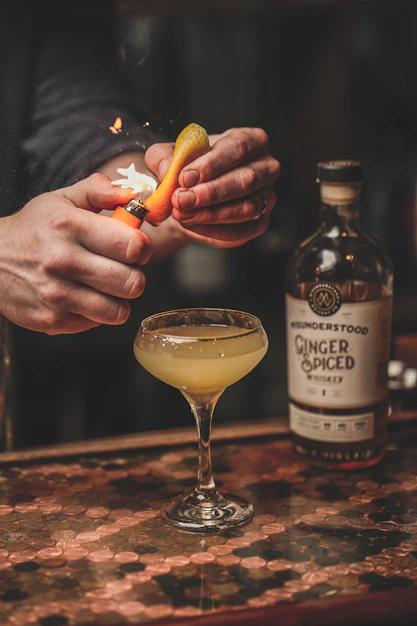 person holding corona extra bottle
