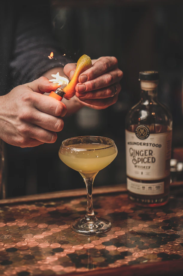 person holding corona extra bottle