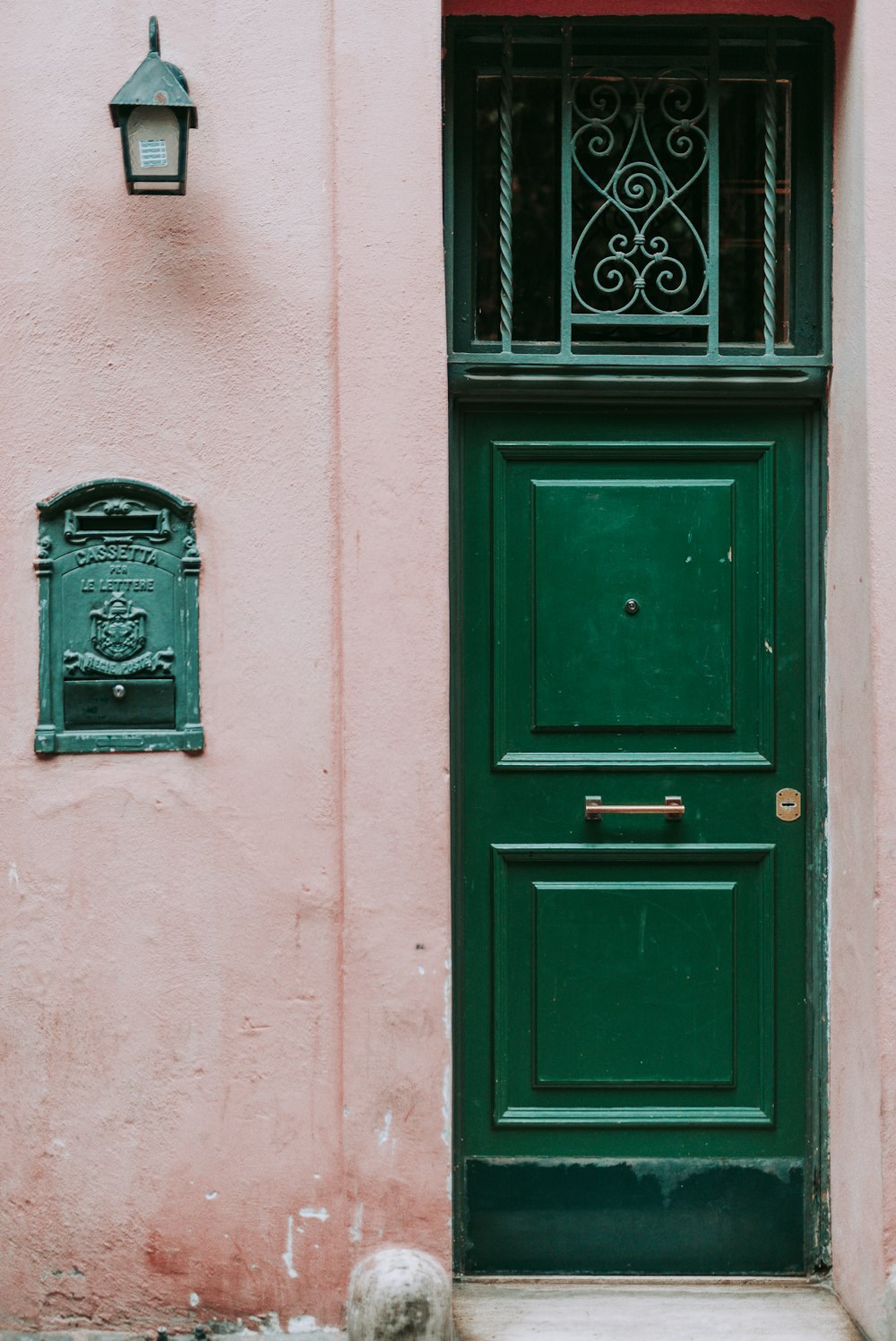 black wooden door with black steel door knob