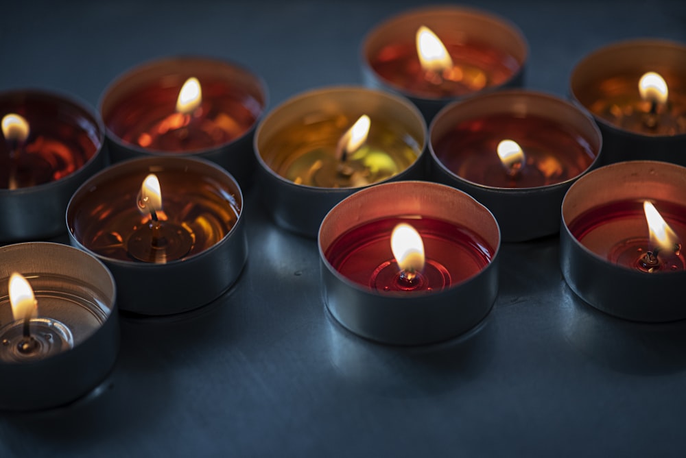 lighted candles on blue surface