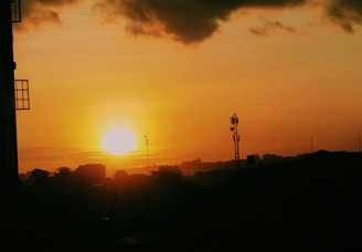 Sunset casting warm light over a partially built tower.
