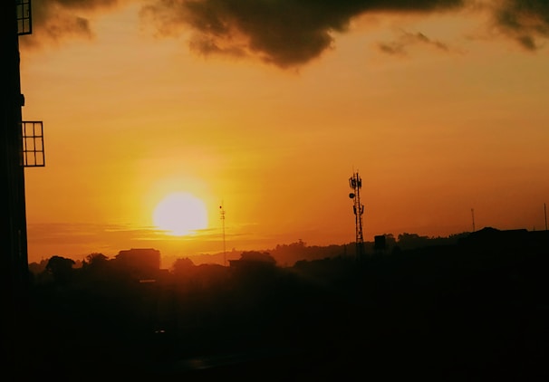 Sunset casting warm light over a partially built tower.