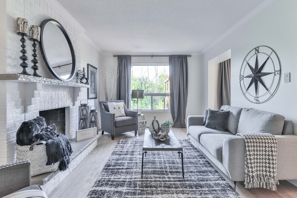 white and black plaid sofa near window