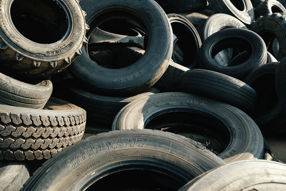 black car tire on brown wooden table