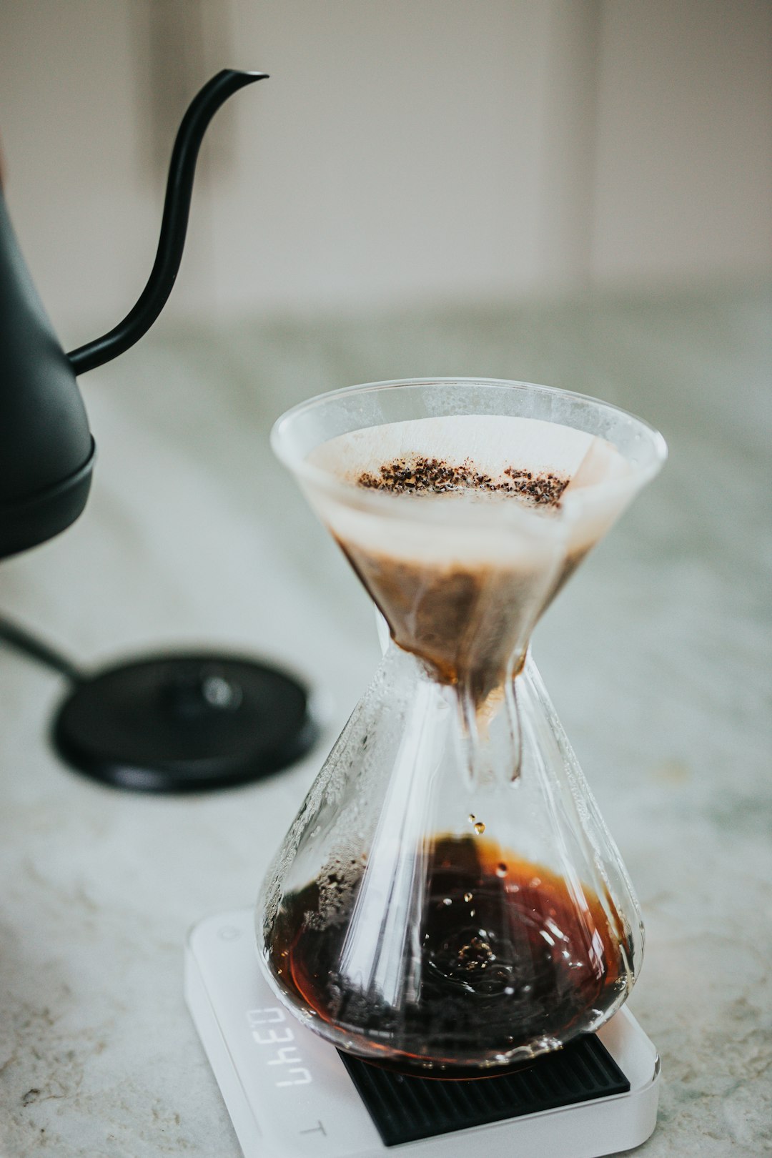 clear glass cup with brown liquid