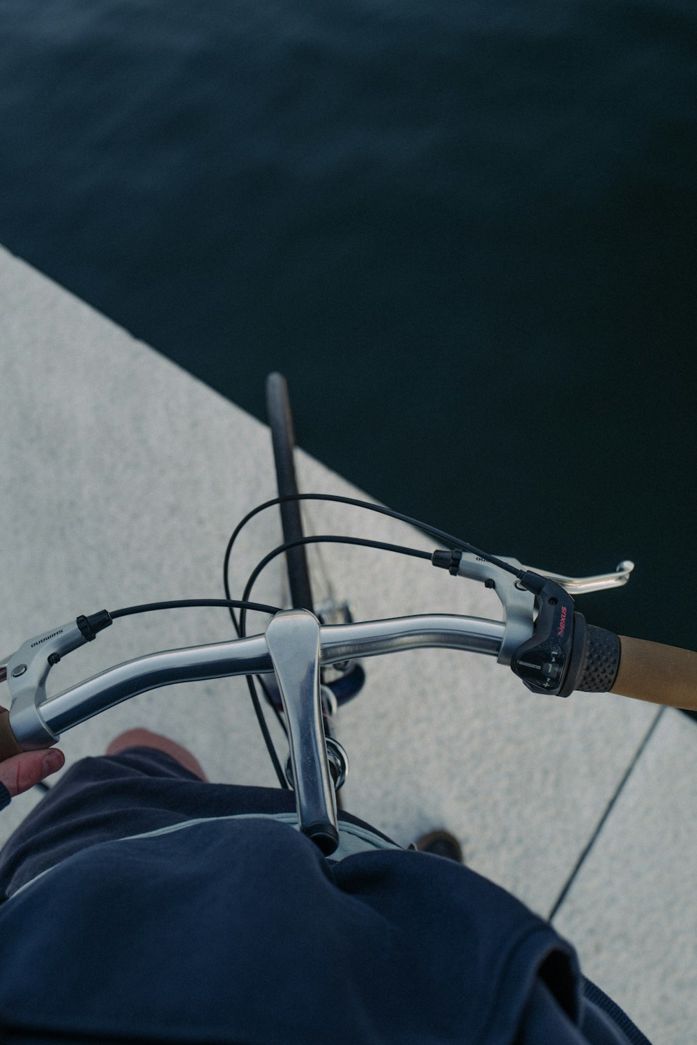 person in blue denim jeans riding on bicycle