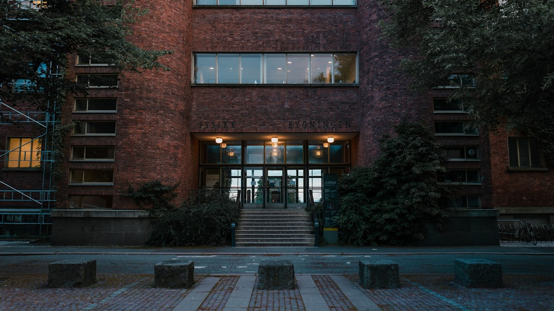 brown brick building with green plants