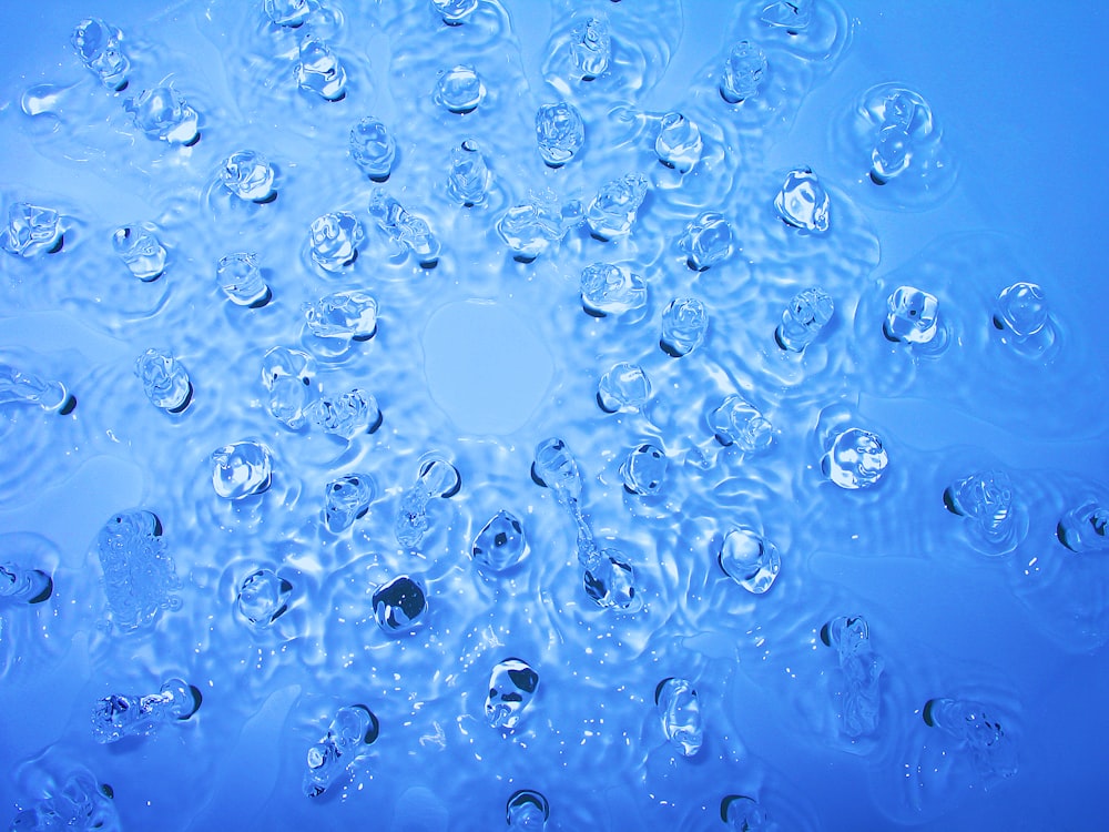 water droplets on blue surface