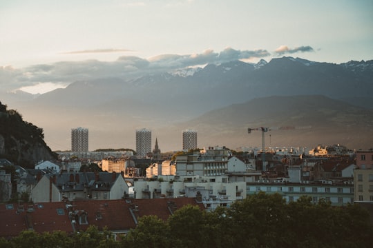 city skyline under white sky during daytime in Grenoble France