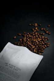 brown coffee beans on black table