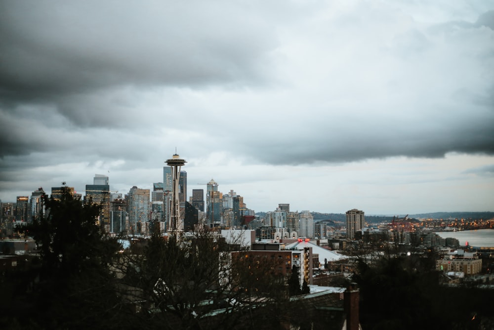 city skyline under cloudy sky during daytime