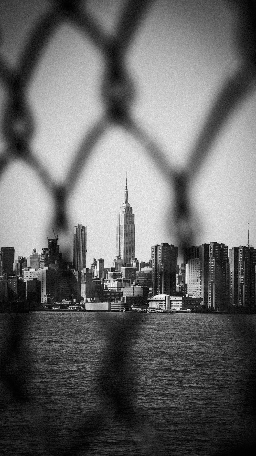 grayscale photo of city skyline during daytime