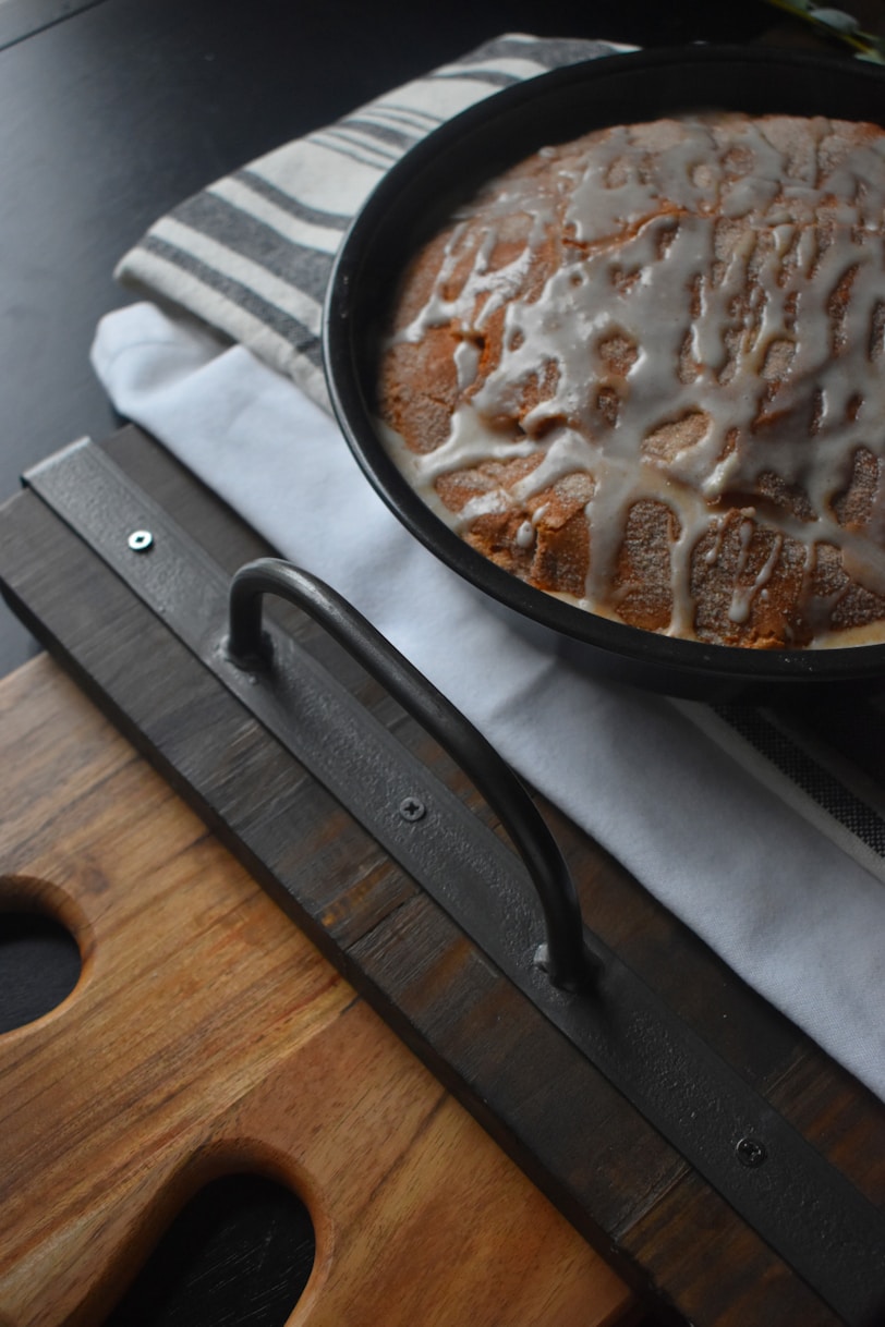 black frying pan on brown wooden table