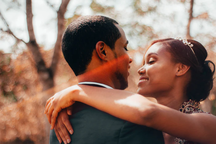 A couple embracing in warm evening light